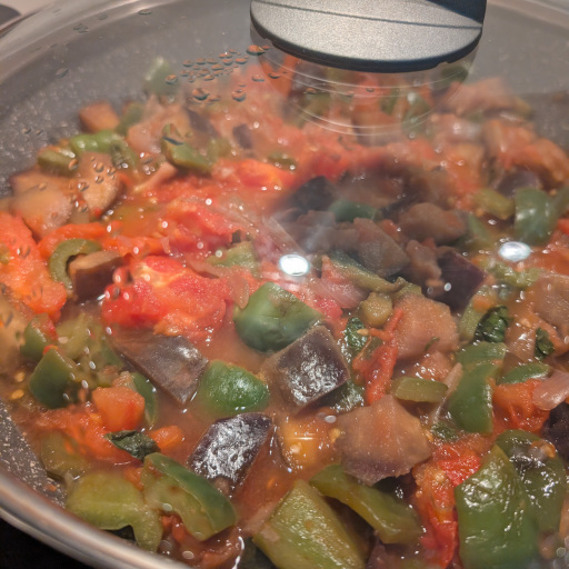 Kapunata simmering slowly as the vegetables soften into a stew